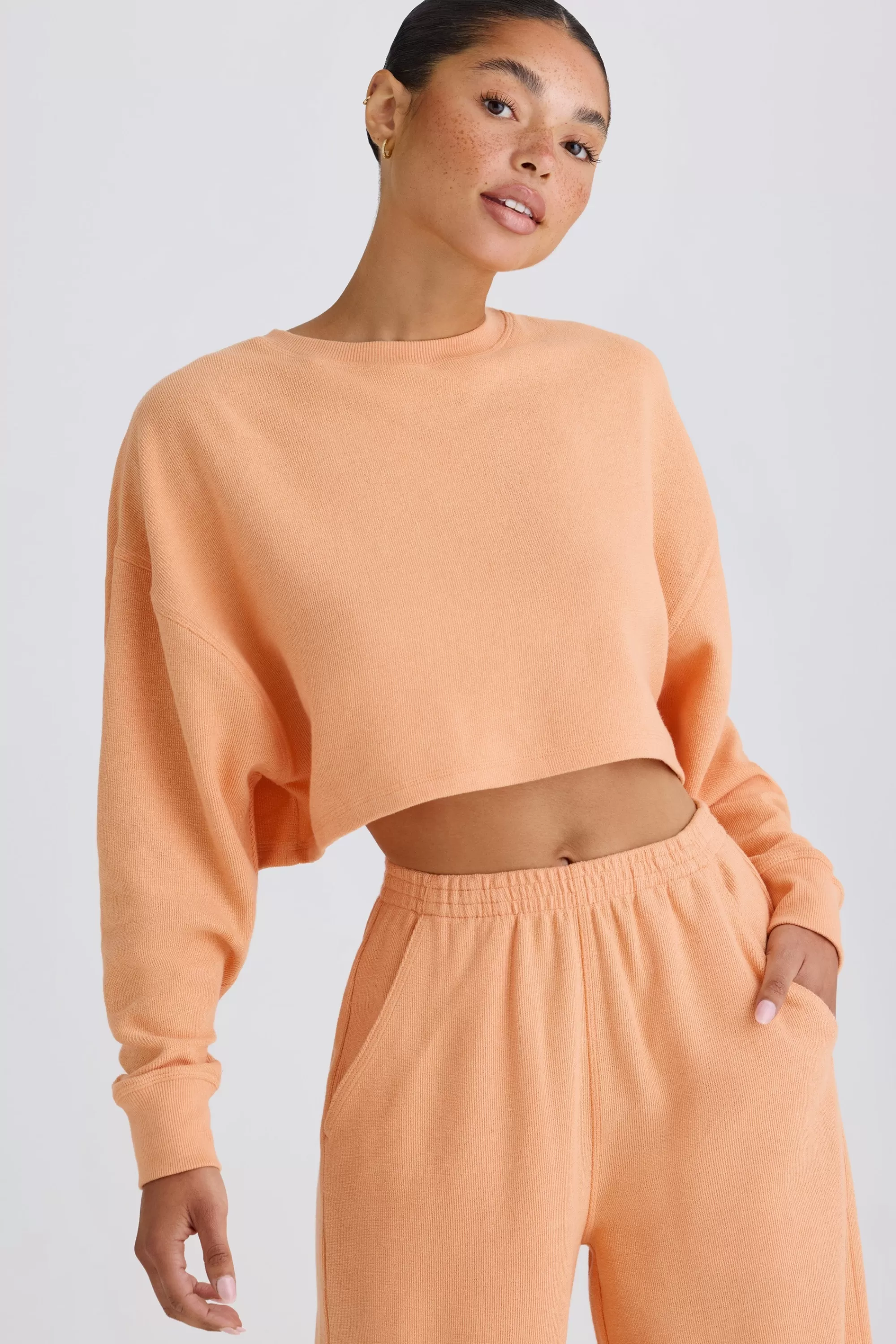 Oh Polly Crew-Neck Open-Back Cropped Sweatshirt in Peach Clearance