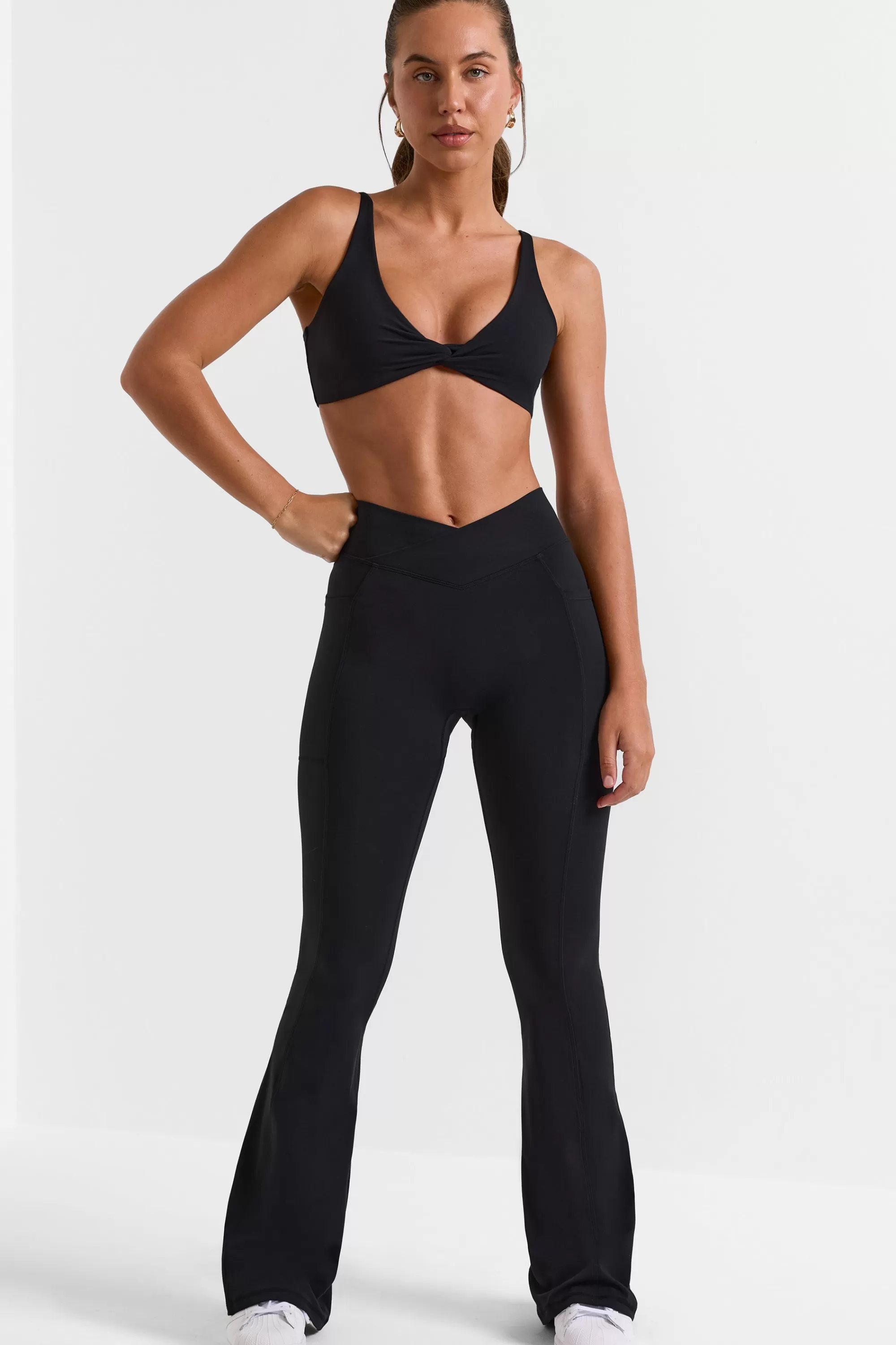 Oh Polly Cross Waistband Flare Pocket Leggings in Black Best