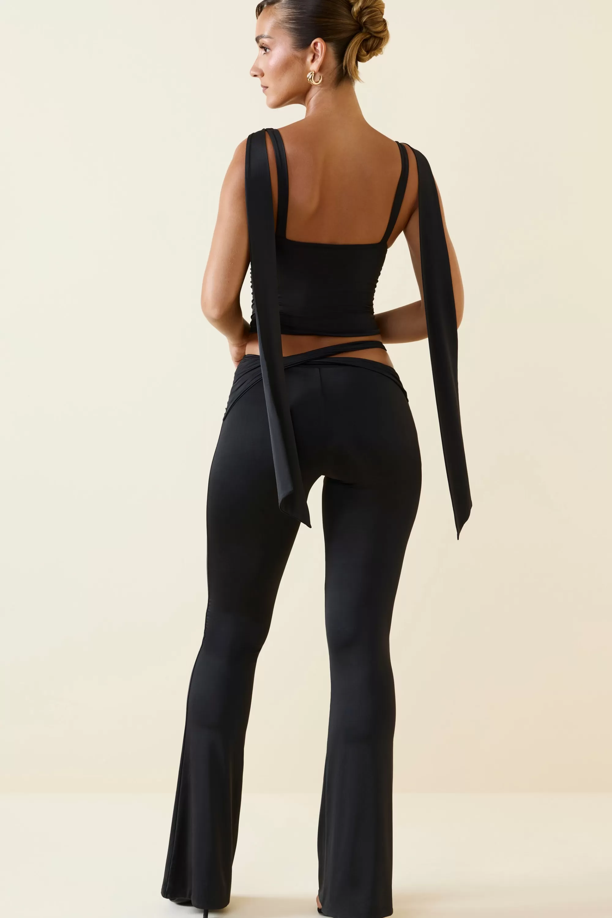 Oh Polly Cut-Out Mid-Rise Flared Trousers in Black Store