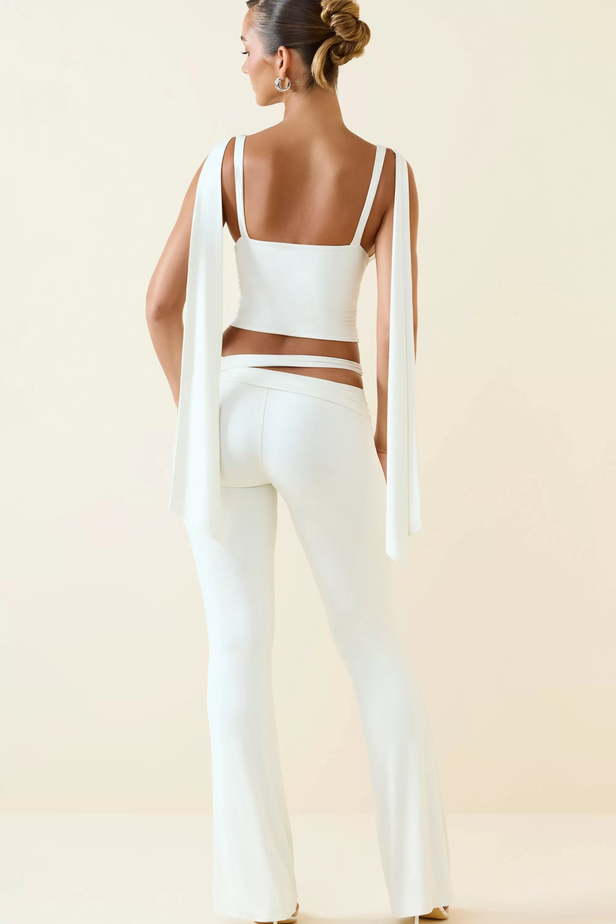 Oh Polly Petite Cut-Out Mid-Rise Flared Trousers in Vanilla Hot