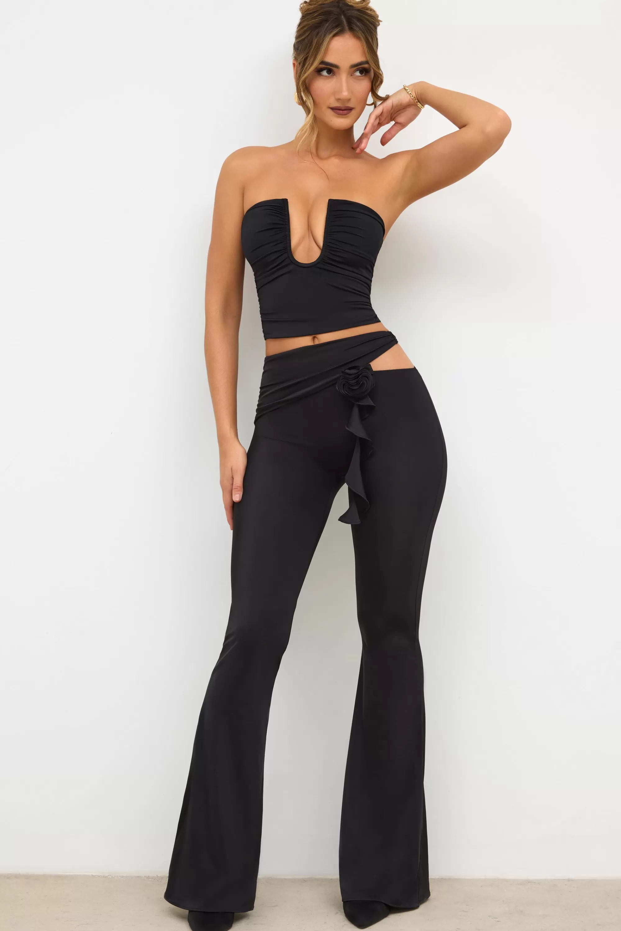Oh Polly Petite Premium Jersey Rose Detail Mid-Rise Flare Trousers in Black Shop