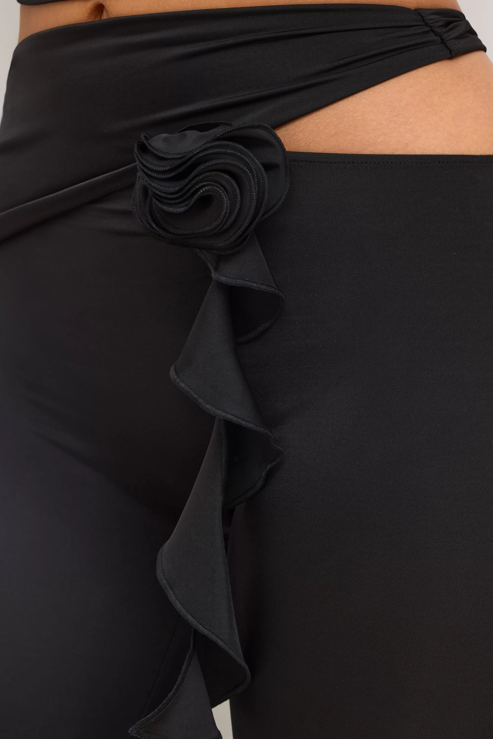 Oh Polly Petite Premium Jersey Rose Detail Mid-Rise Flare Trousers in Black Shop