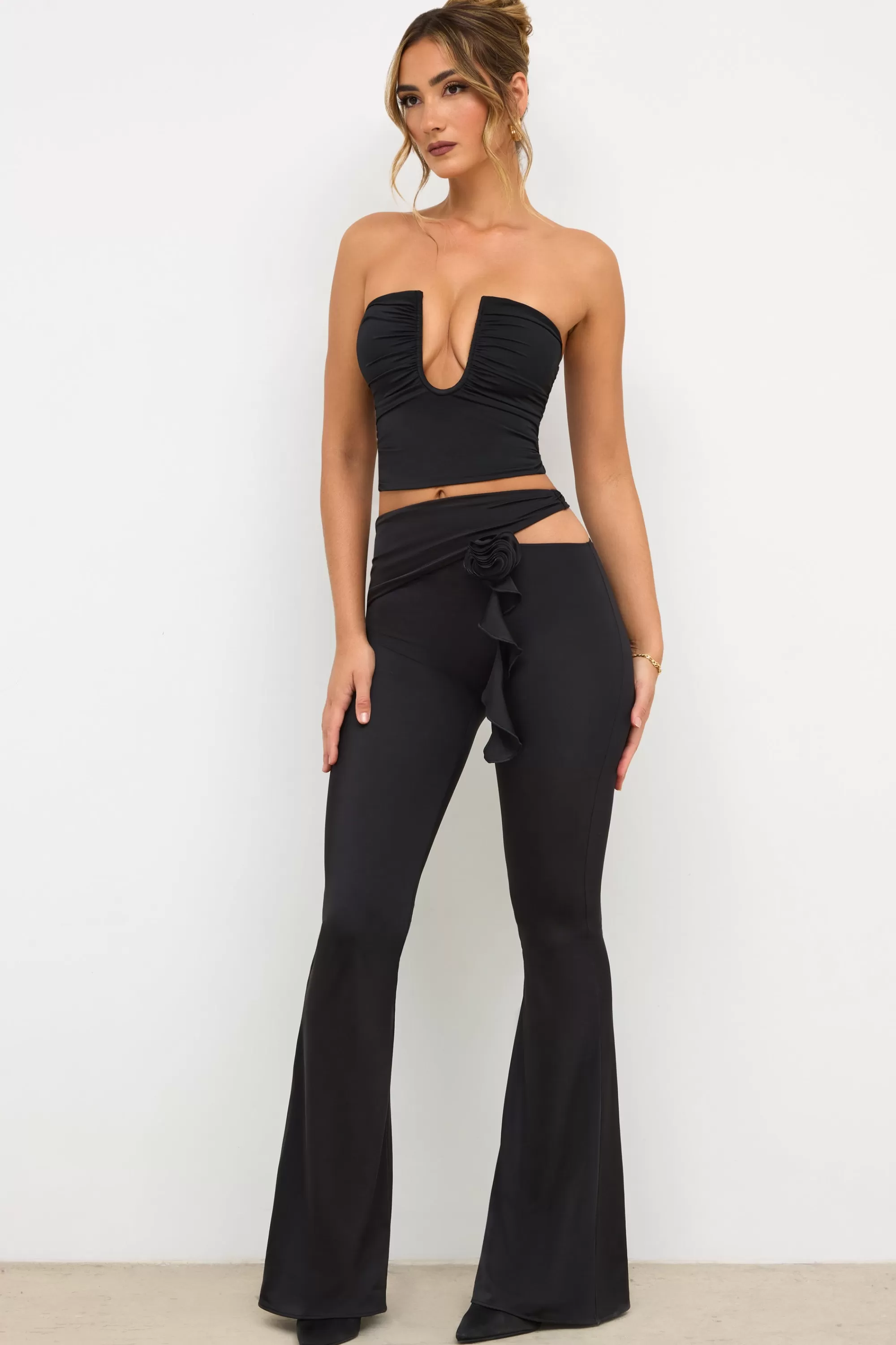 Oh Polly Petite Premium Jersey Rose Detail Mid-Rise Flare Trousers in Black Shop