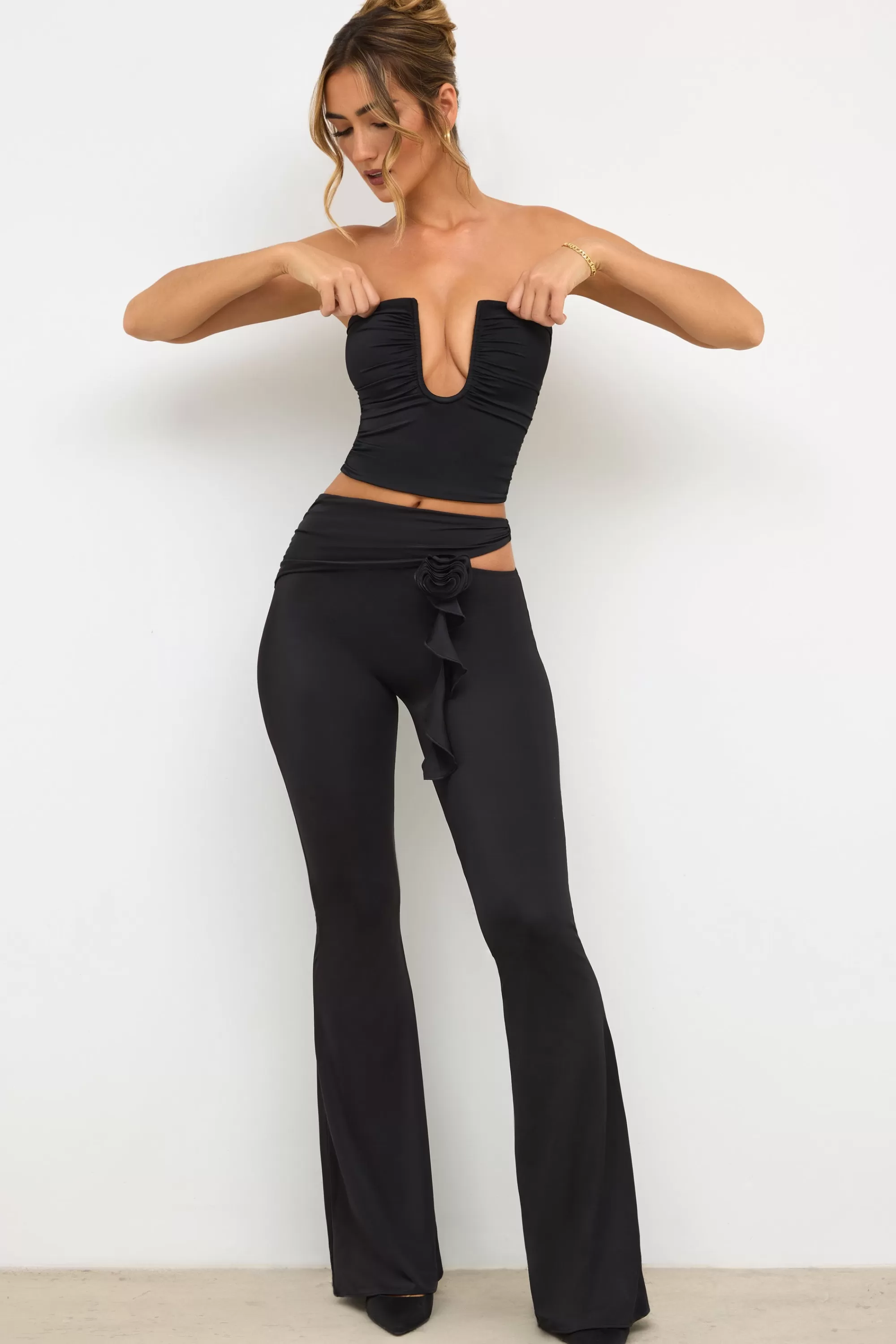 Oh Polly Petite Premium Jersey Rose Detail Mid-Rise Flare Trousers in Black Shop