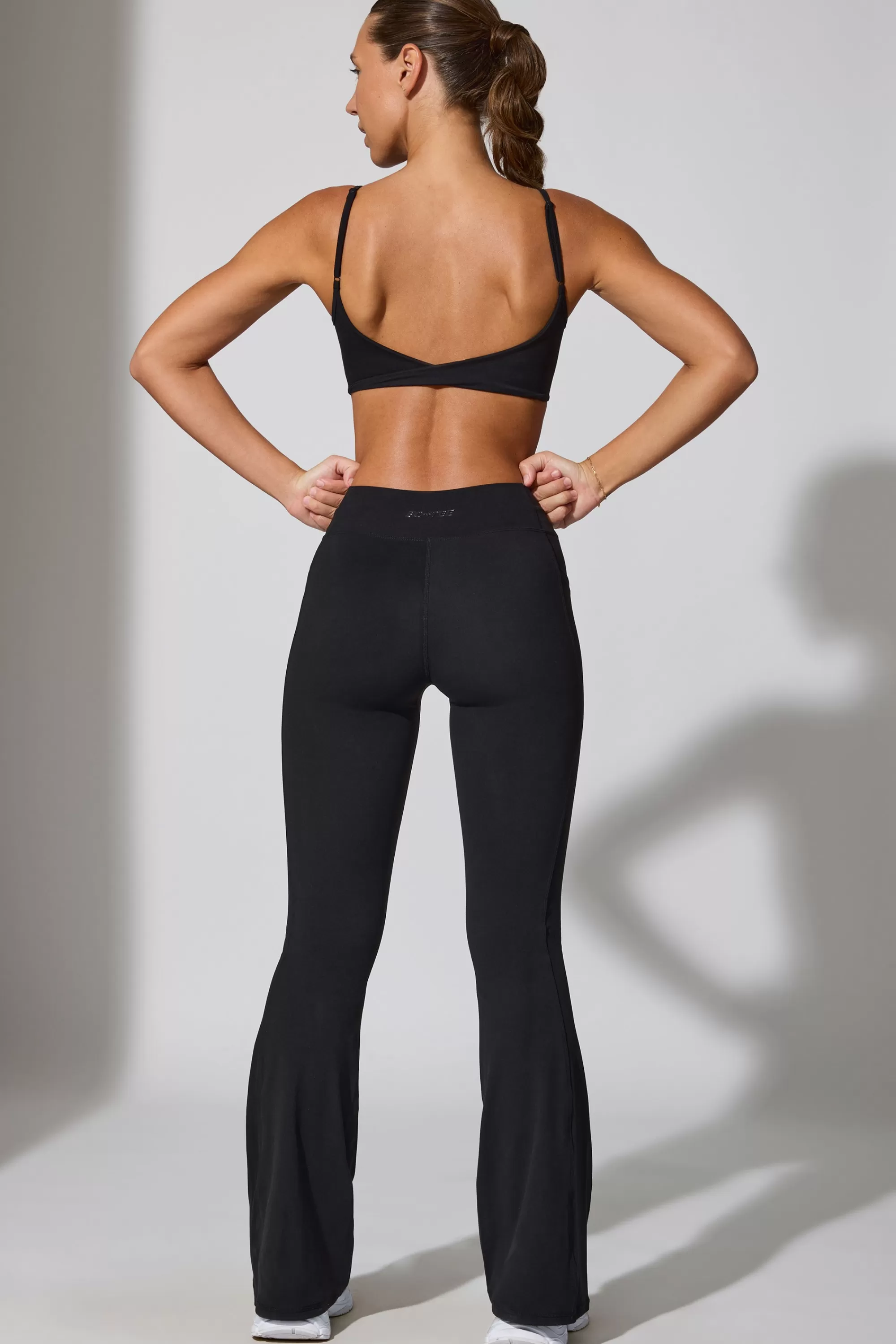 Oh Polly Petite Twist Waist Flare Leggings in Black Discount