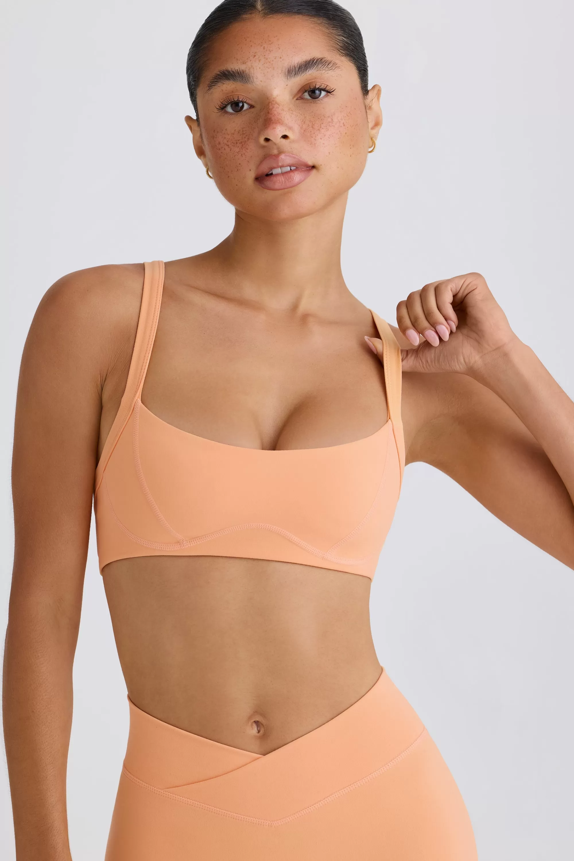 Oh Polly Soft Active Contrast-Trim Sports Bra in Peach Store