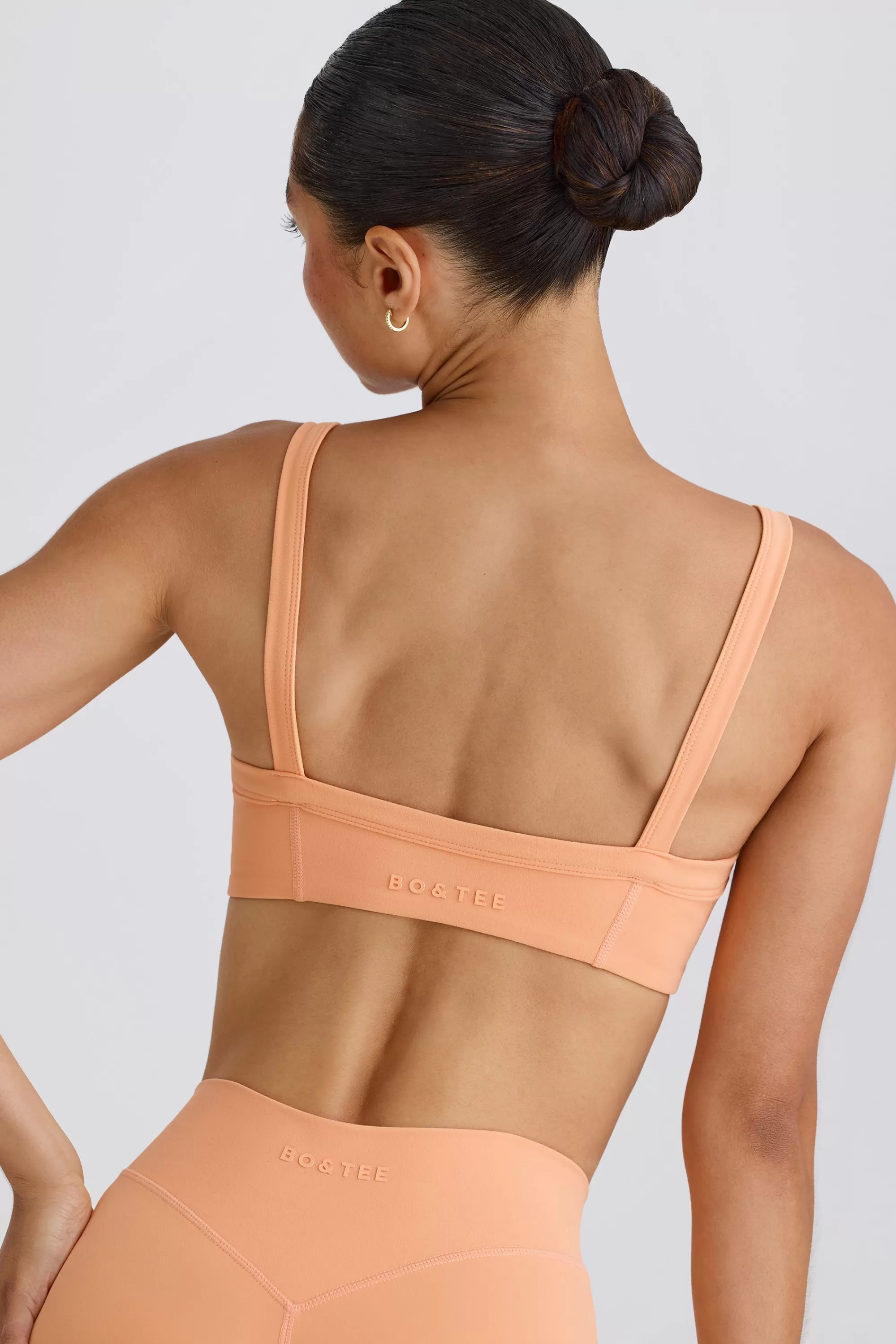 Oh Polly Soft Active Contrast-Trim Sports Bra in Peach Store