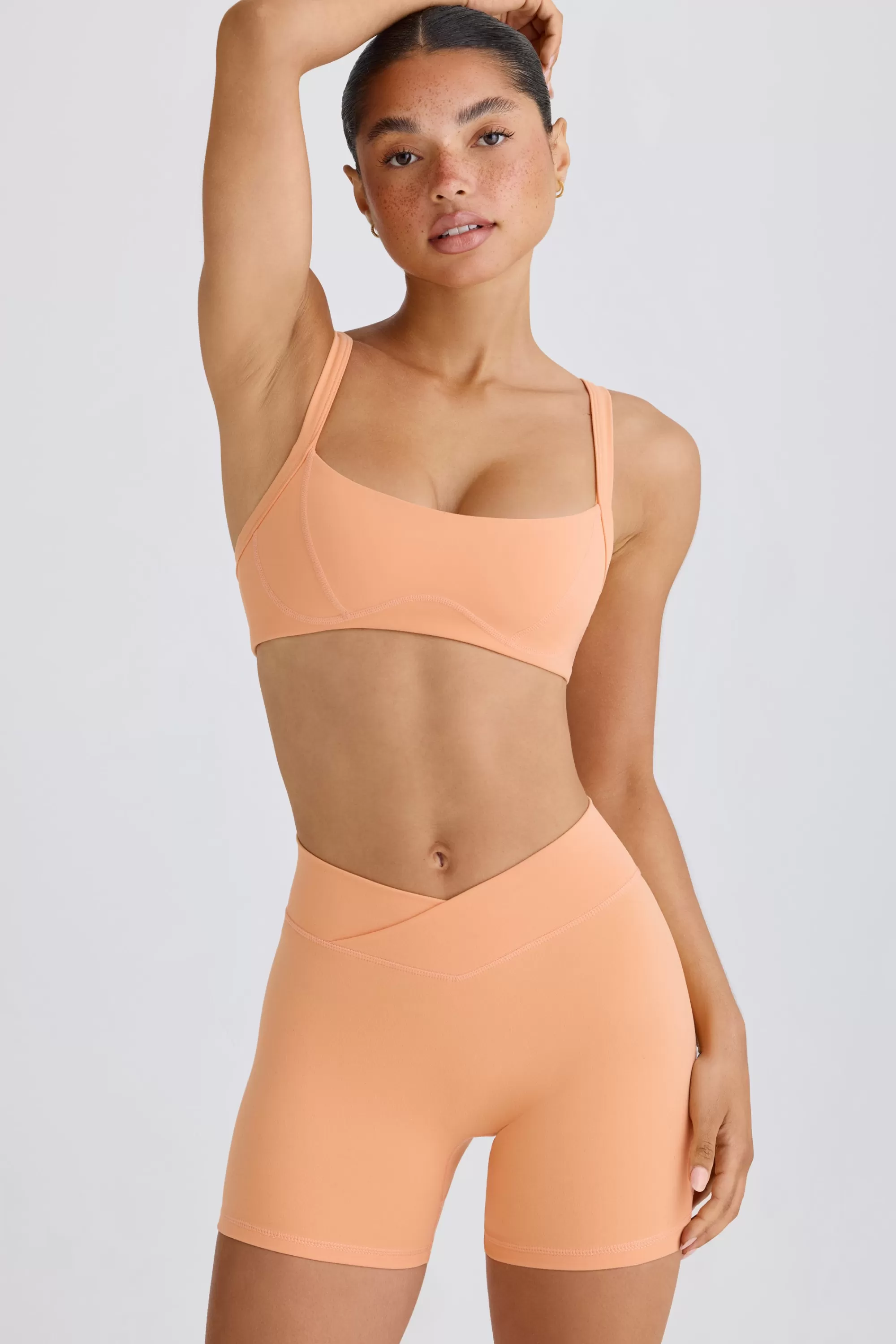 Oh Polly Soft Active Crossover Mini Shorts in Peach Sale