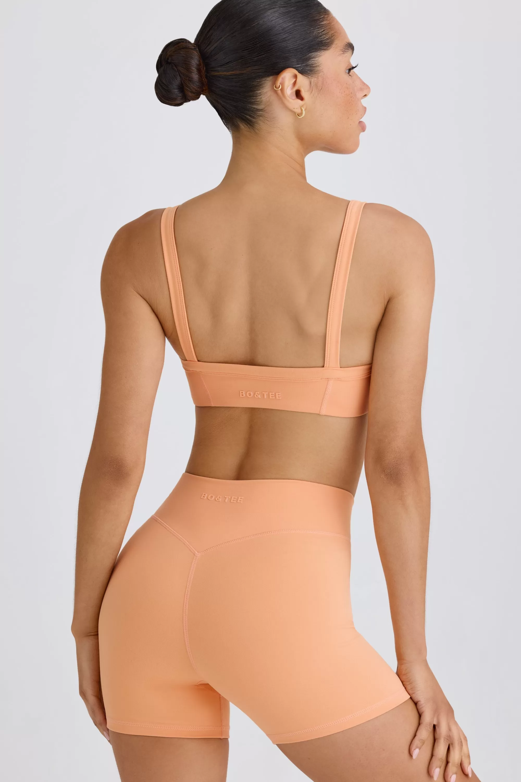 Oh Polly Soft Active Crossover Mini Shorts in Peach Sale