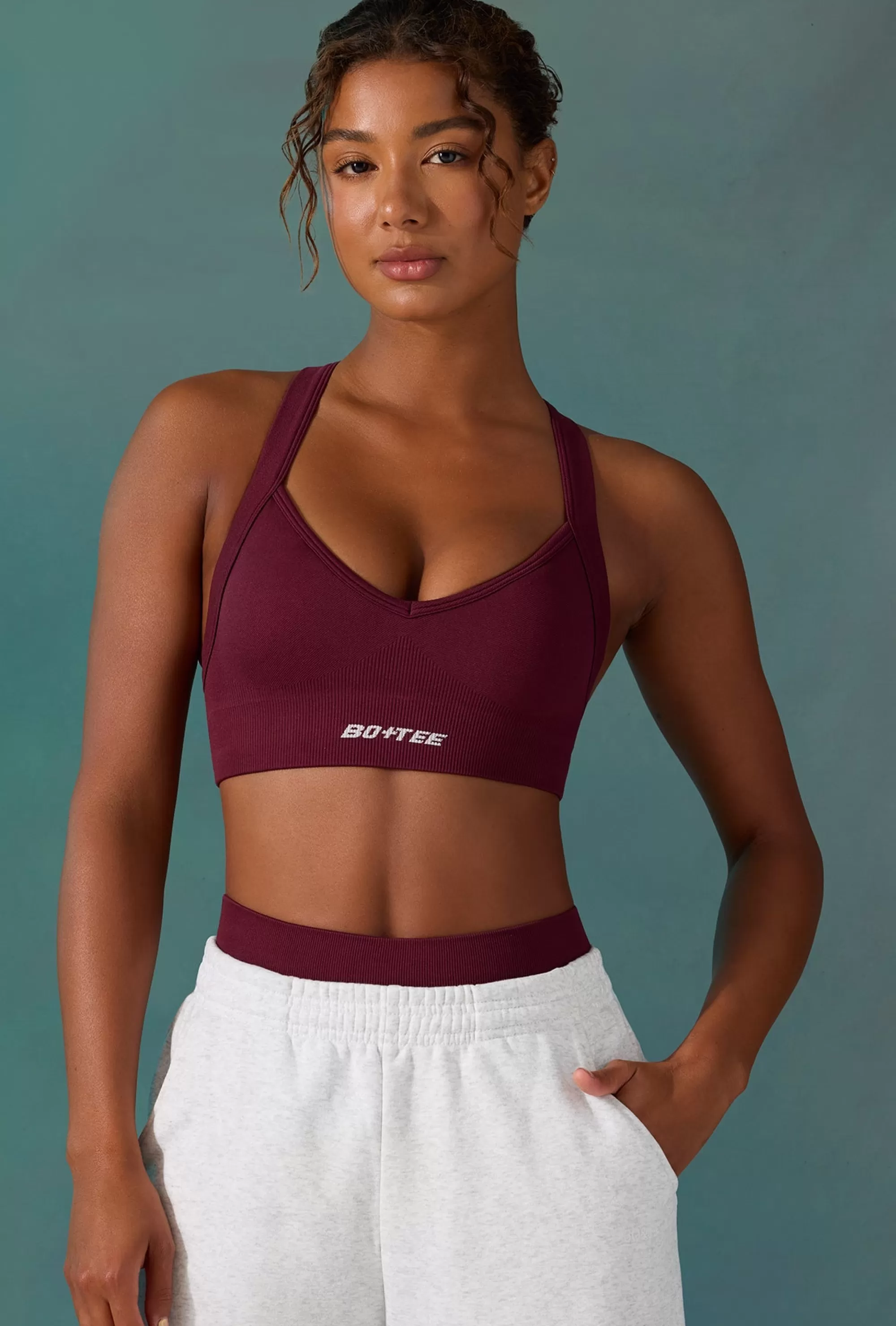 Oh Polly Super Sculpt Seamless Cross Back Sports Bra in Plum Store