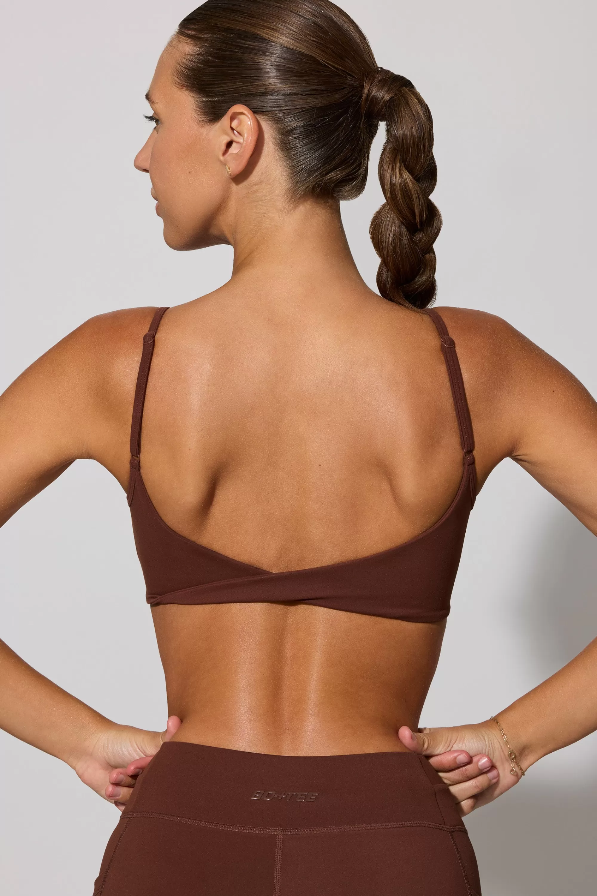 Oh Polly Twist Back Scoop Neck Sports Bra in Chocolate Online